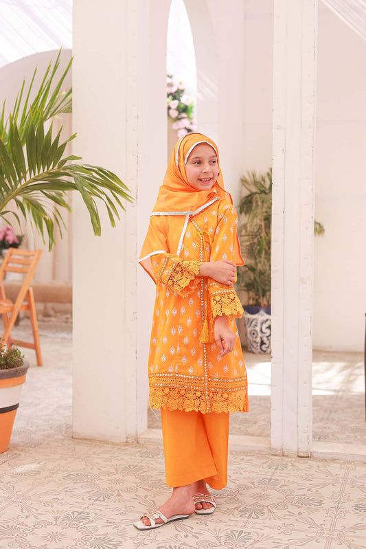 A girl wearing an orange and silver embroidered Angrakha frock with sleeve embroidery and a dupatta.