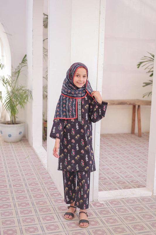 Child wearing a dark floral outfit with a matching hijab in a room with plants and a table.
