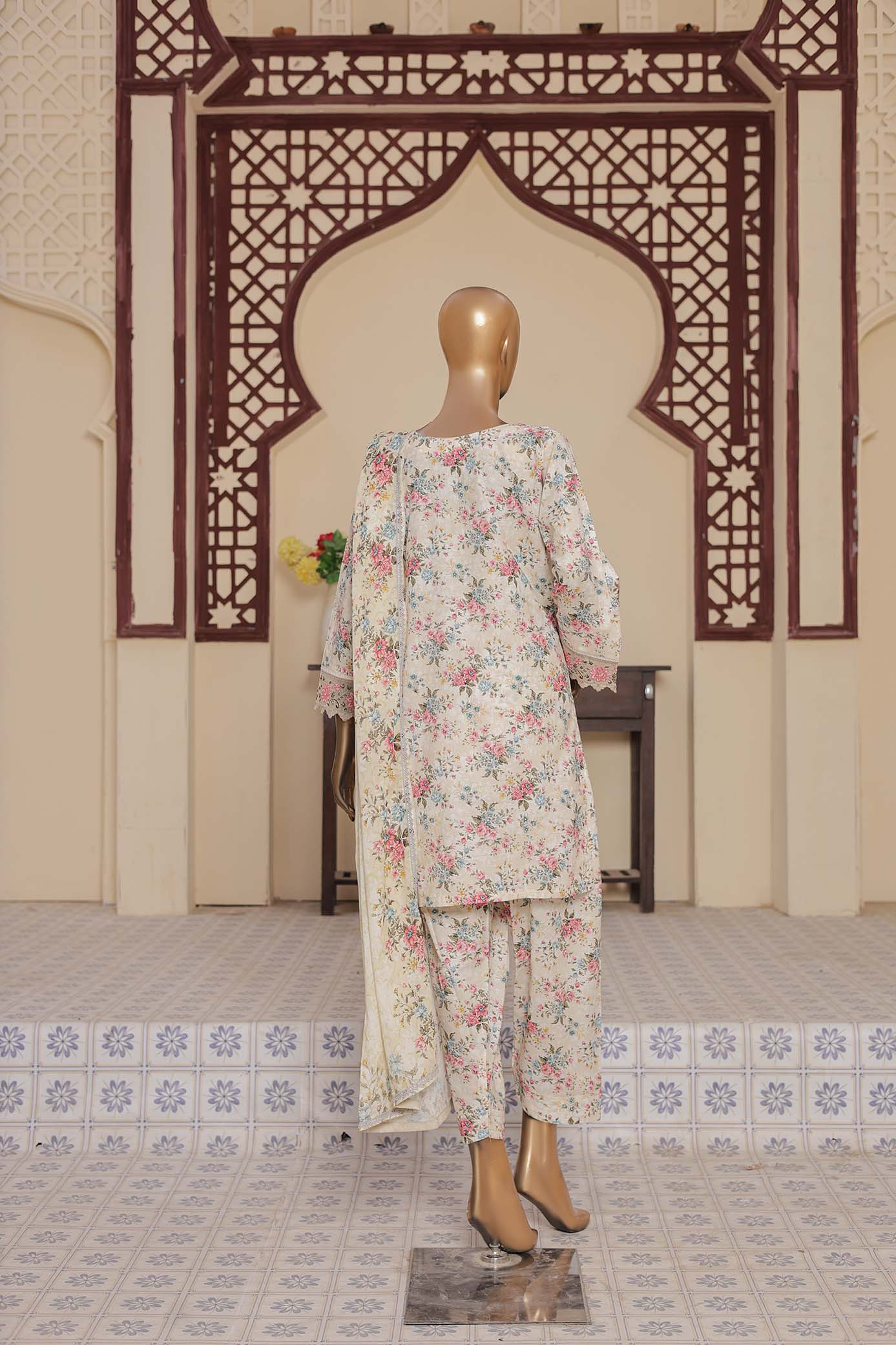 Floral dress on a mannequin against an ornate wall with geometric patterns.