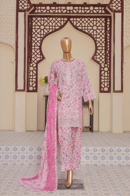 Mannequin wearing a pink floral outfit with a matching dupatta in front of an ornate archway.
