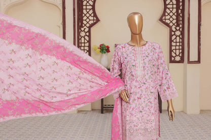 Mannequin wearing a pink floral dress with a matching pink dupatta in a room with decorative elements.