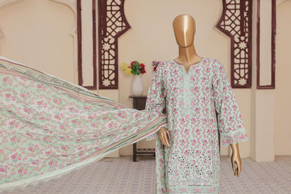 Mannequin wearing a floral dress with a matching dupatta in a room setting.
