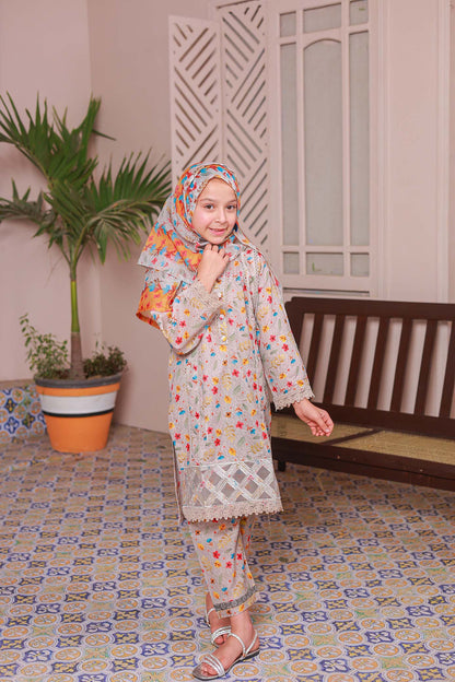 A girl wearing an ivory shirt with embroidery, paired with a printed dupatta and trousers, posing indoors.