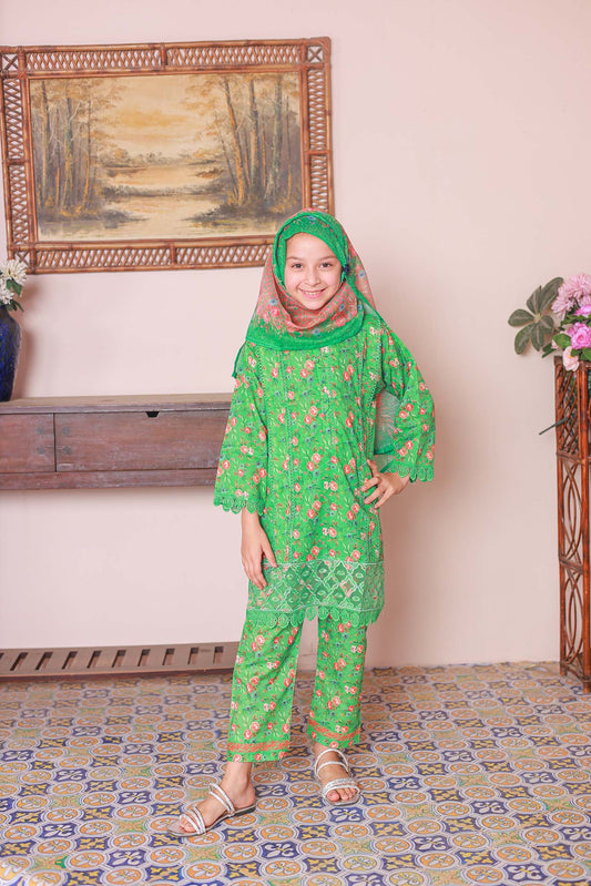 A girl wearing a green embroidered shirt with long sleeves, paired with a matching dupatta and printed cambric trousers.